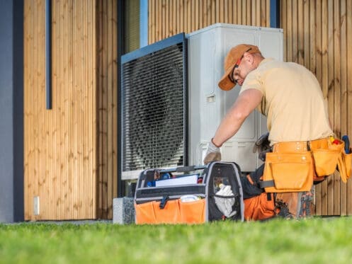 Technician Fixing Heat Pump